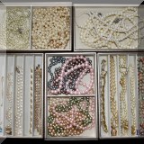 J12. Faux pearl jewelry.
